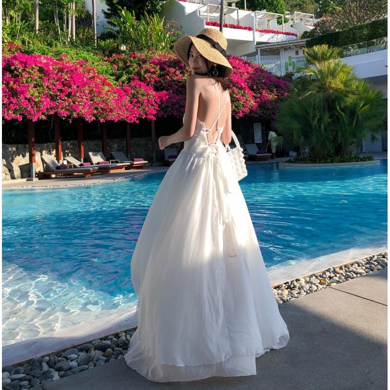 The real shot is very fairy beach dress, white niche suspender backless dress, women's summer seaside vacation ins super hot