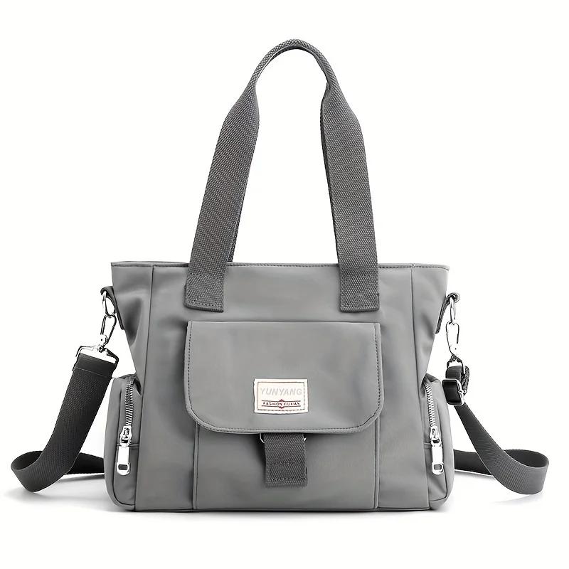 

New fashionable women s bag, large capacity versatile solid color handbag, zipper closure, simple casual canvas crossbody bags сірий