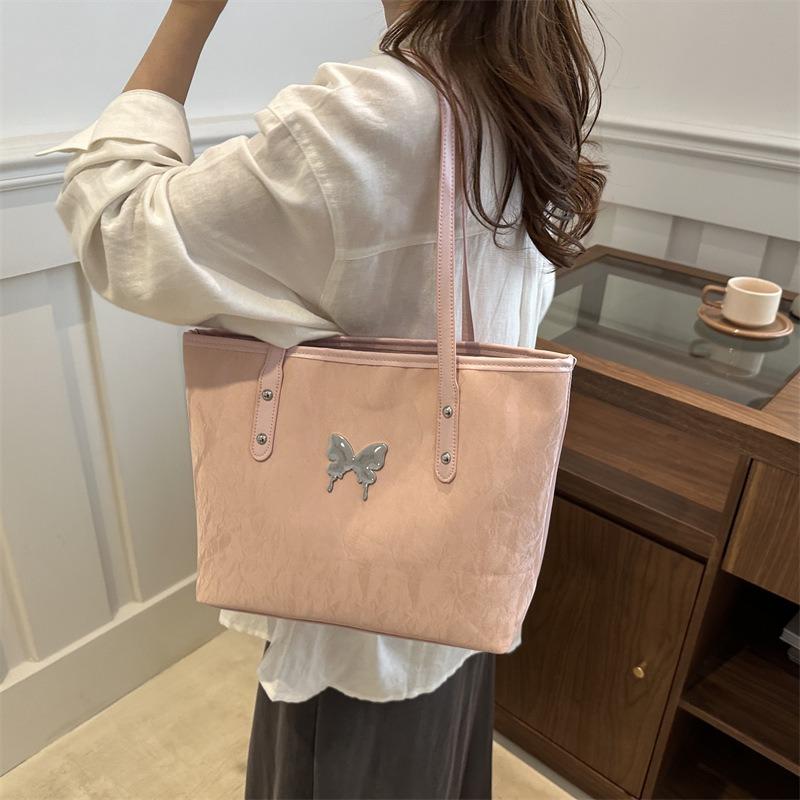 Die neue modische Pendler-Damentasche ist jetzt beliebt, Schmetterlingshalter, extra-große Tasche und Damen-Schultertasche mit großem Fassungsvermögen.