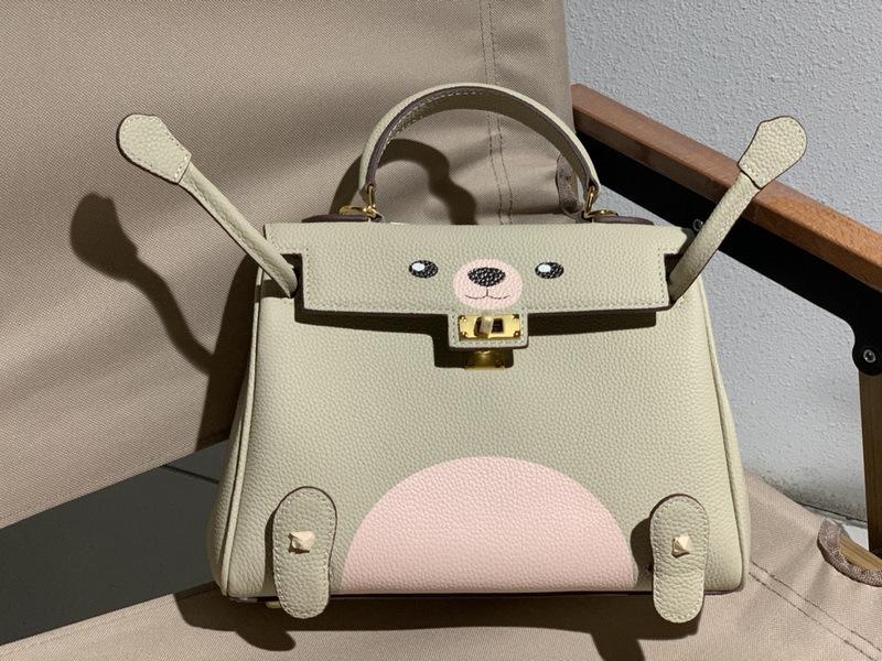 New Genuine Leather Women's Bag Head Layer Leather TOGO Leather Shattered Dimension Cartoon Graffiti Smiling Face Doll Women's Bag