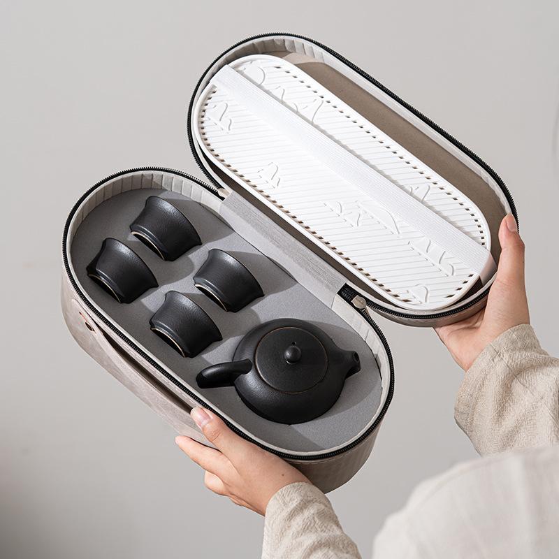 

Coarse pottery travel tea set Kung Fu tea set travel bag outdoor one pot four cups portable beam pot tea maker