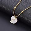 Elegant Gold Titanium Steel Women's Necklace with White Shell, Zircon, and Monogram Tassel