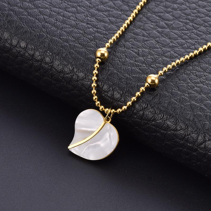 Elegant Gold Titanium Steel Women's Necklace with White Shell, Zircon, and Monogram Tassel
