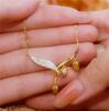 Elegant 18K Gold-Plated Lily of the Valley Necklace for Women – High-End Design Fashion Clavicle Chain Pendant