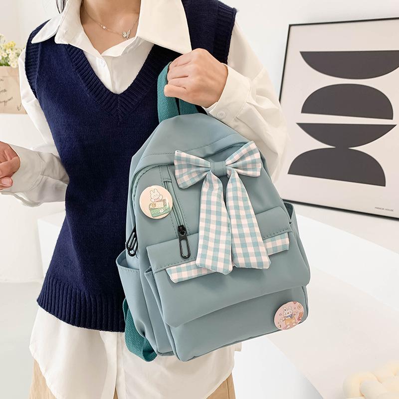 Bow schoolbag Female primary school students Large capacity 3rd to 6th grade high school lightweight weight weight reduction Cute simple backpack