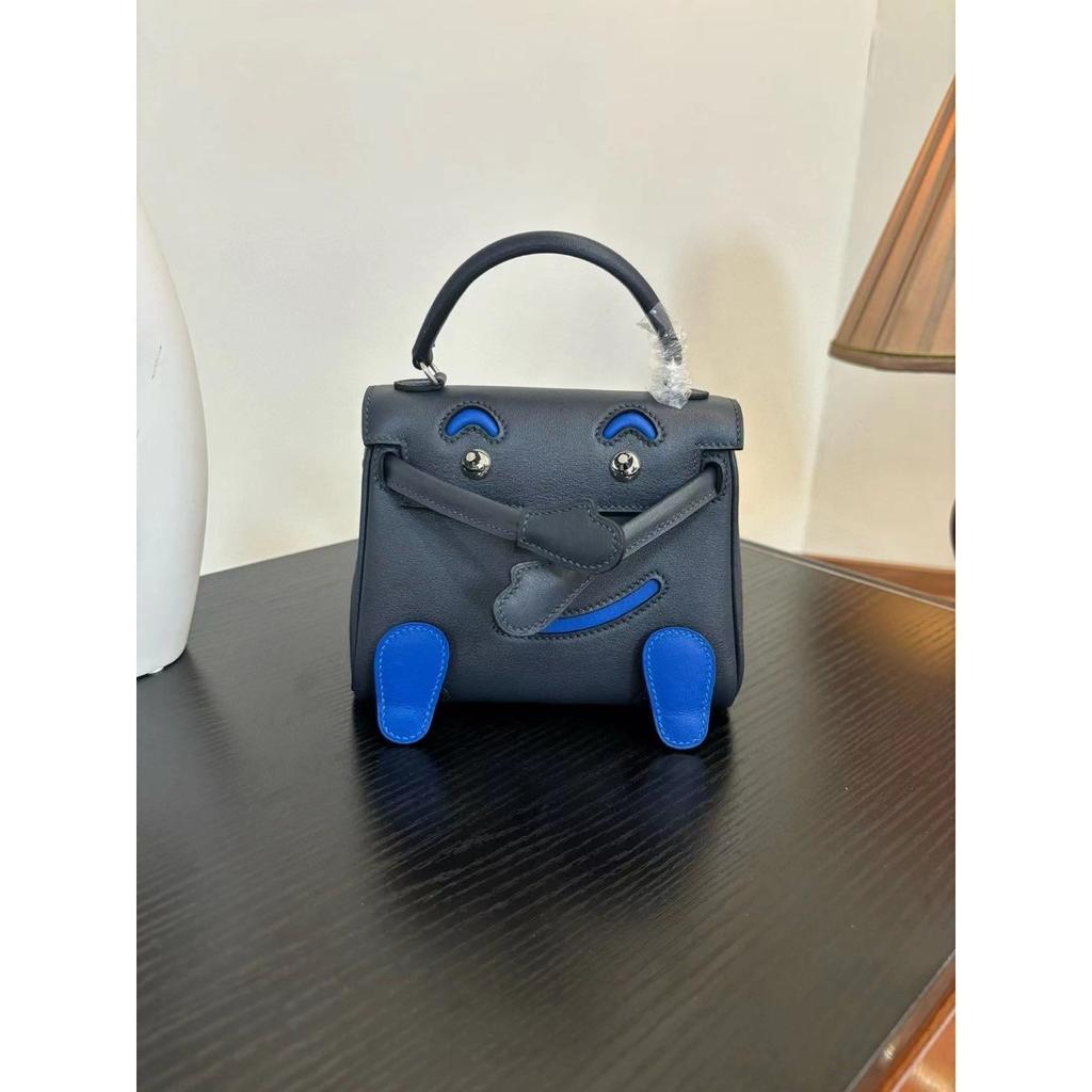 Borsa a faccina sorridente nuova per la primavera e l'estate 2025 borsa Kelli mini in pelle bovina di primo strato di alta gamma borsa a tracolla carina da millenial