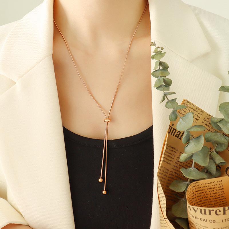 Stylish Non-Fade Round Bead Pull-Out Buckle Women’s 18K Gold-Plated Titanium Steel Jewelry Set: Tassel Necklace, Bracelet, Anklet.