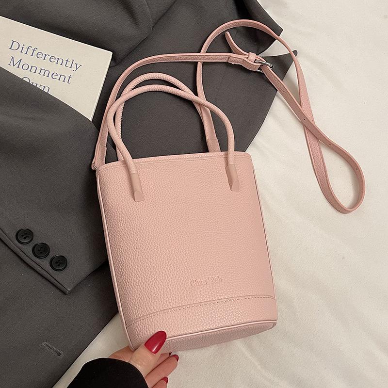 This year's popular niche simple dopamine lychee pattern portable bucket bag women's versatile casual messenger mobile phone bag