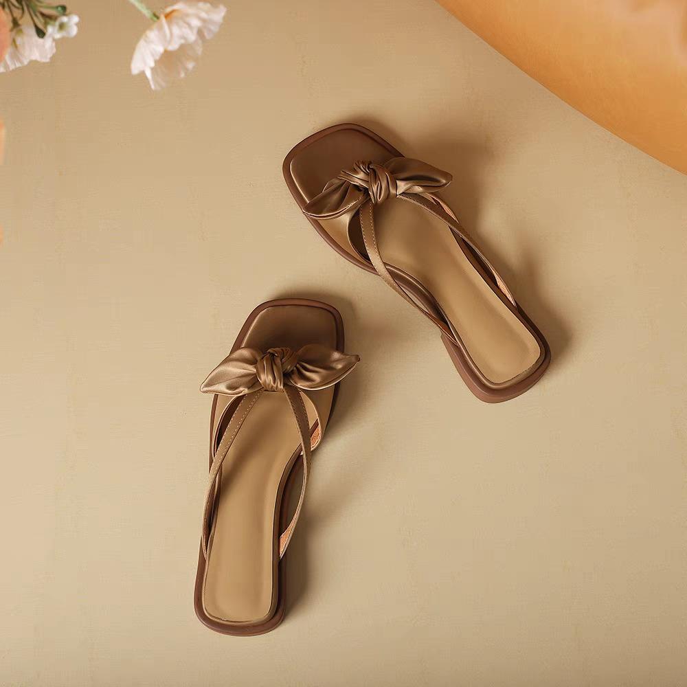 2025 new fashion bow cool slippers women's casual one-word slippers women's summer outer wear fairy flat slippers