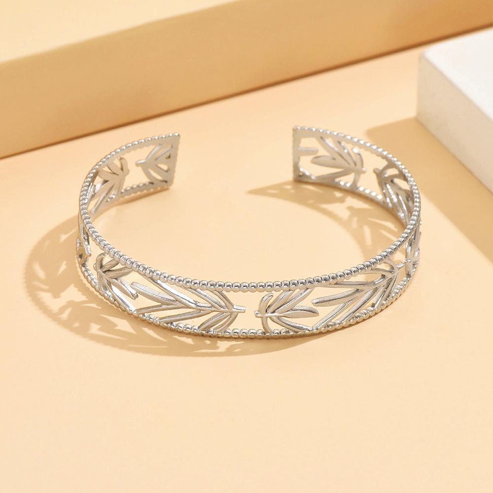 Elegant Retro Hollow Leaf Bamboo Bracelet - Artistic Stainless Steel Women s Jewelry