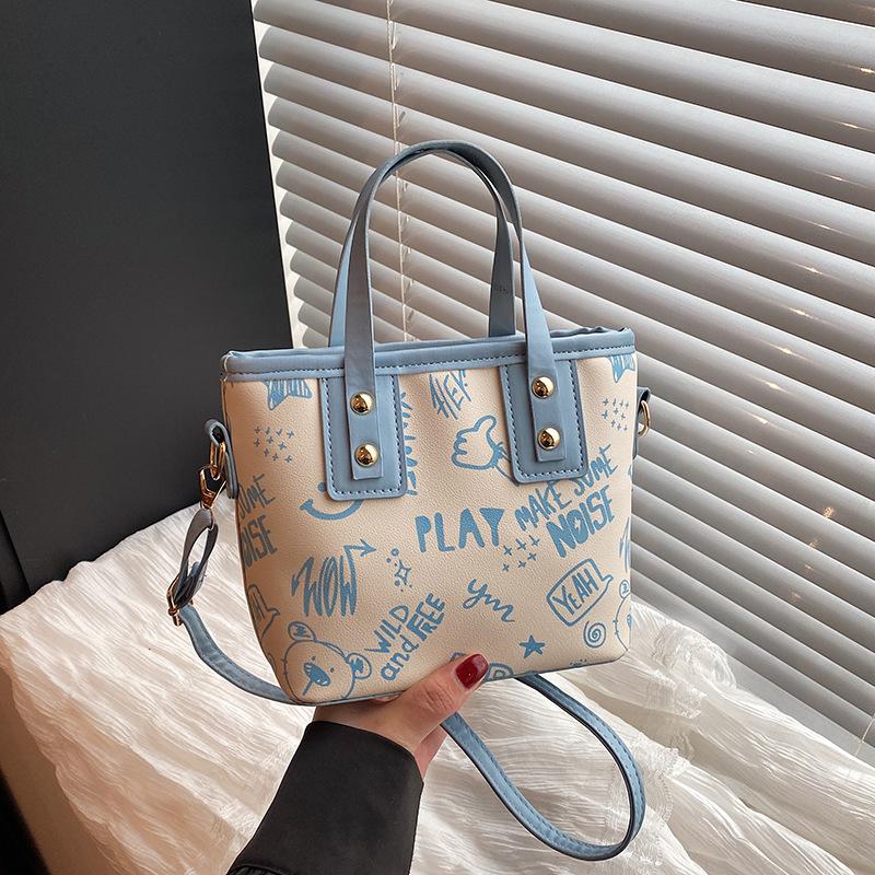 Fashionable and Trendy Printed Shoulder Bag for Women's New Simple Hand To Wear Tote Bag for College Students' Commuting Class Bag