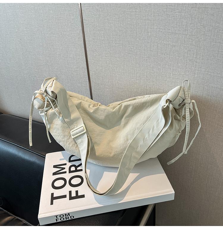 Outdoor sports wind large capacity canvas shoulder messenger bag retro tied knot handbag women's casual new dumpling bag