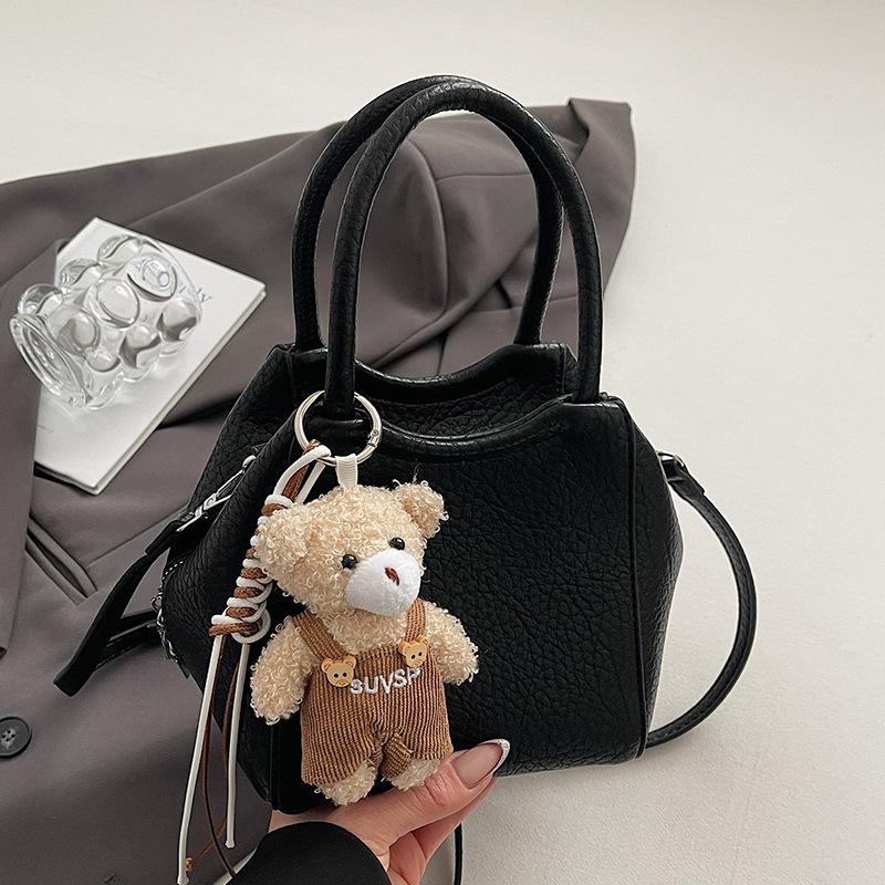 Wholesale fashion high sense simple style solid color lychee pattern bucket bag casual versatile commuter messenger women's bag