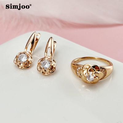 Сережки SIMJOO з рожевого золота і квіти з цирконом. Набір кілець
