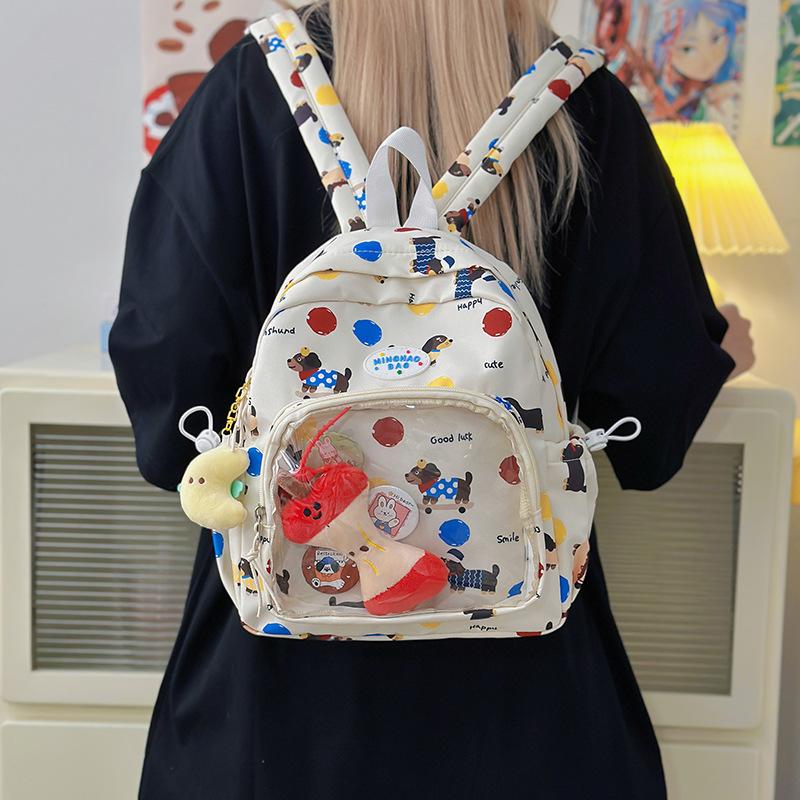 Cute graffiti schoolbag for junior high school girls, large capacity backpack, transparent bar, bandage board, pain bag, student backpack