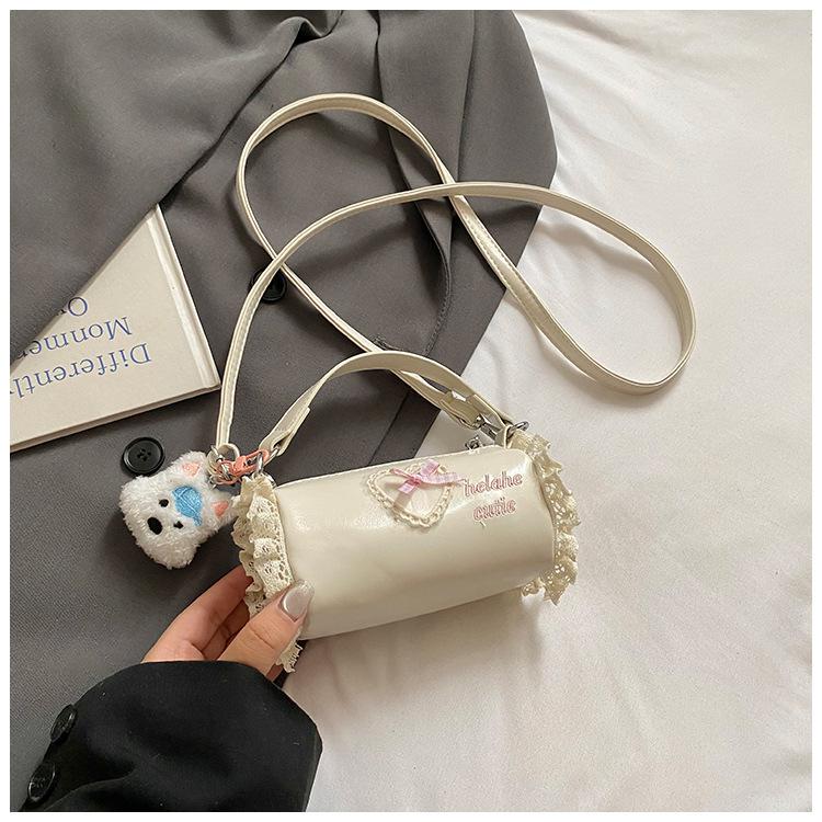 

Korean version of the new niche bow lace sweet cool style mini cylinder bag foreign style polka dot hand carry shoulder messenger bag
