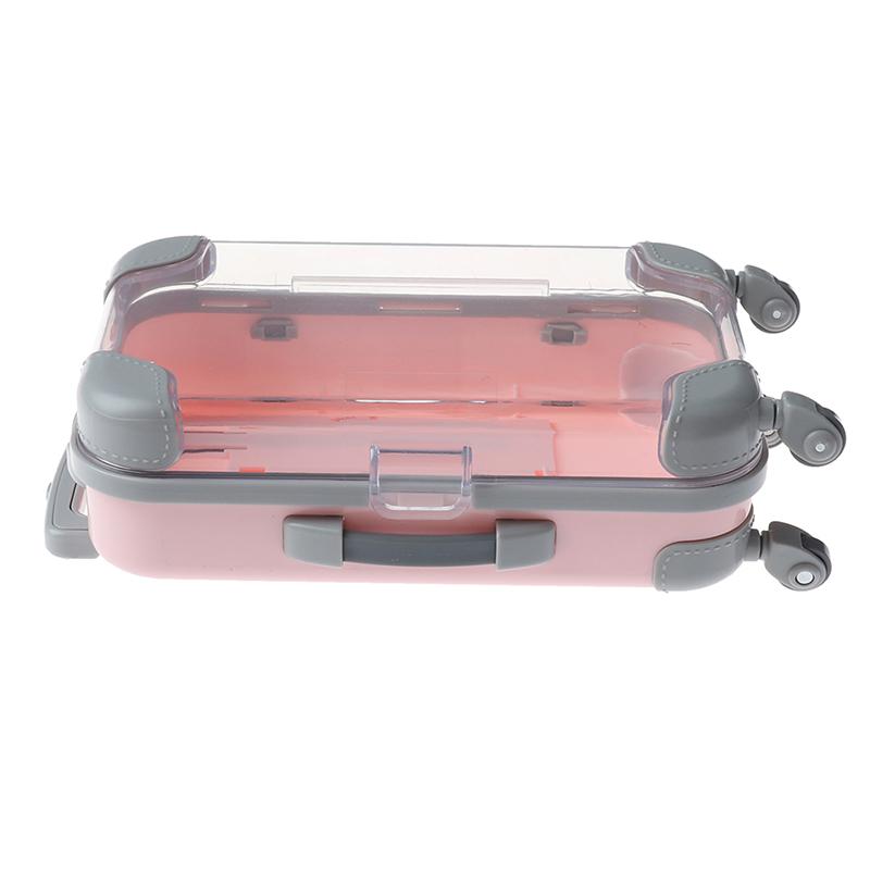 tiny plastic suitcase
