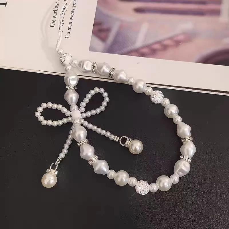 

Pearl bow phone chain suitable for all phone case models, versatile temperament, fashionable women s style, anti loss hanging ro белый
