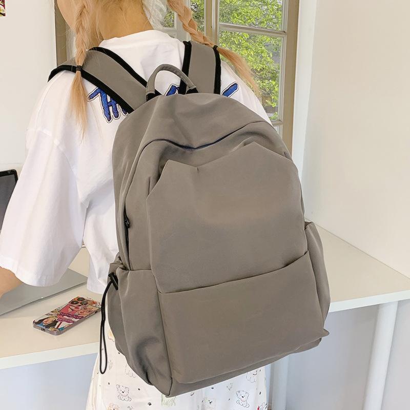 Junior high school backpack large capacity solid color backpack male simple versatile high school college student schoolbag female