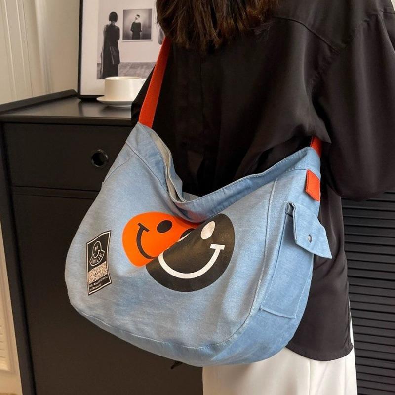 2024 New Korean Style Women's Denim Crossbody Bag: Artistic Smiley Face Canvas with Wide Shoulder Strap