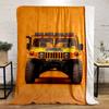 Front view of a bright yellow rugged vehicle against an orange background. for all seasons blanket lunch break throw gift