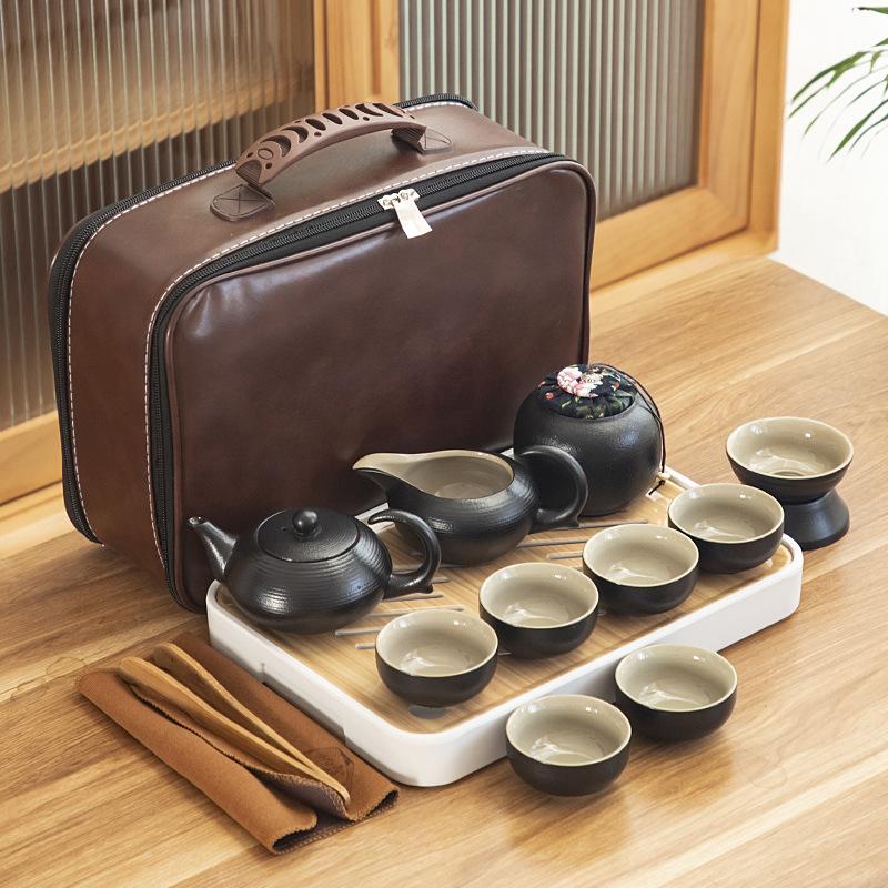Black pottery travel kung fu tea set portable business gift set creative ceramic cooling pot set