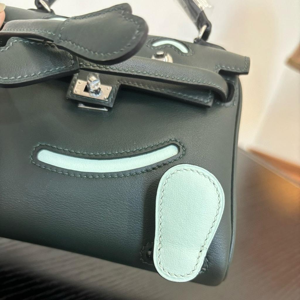 Borsa a faccina sorridente nuova per la primavera e l'estate 2025 borsa Kelli mini in pelle bovina di primo strato di alta gamma borsa a tracolla carina da millenial