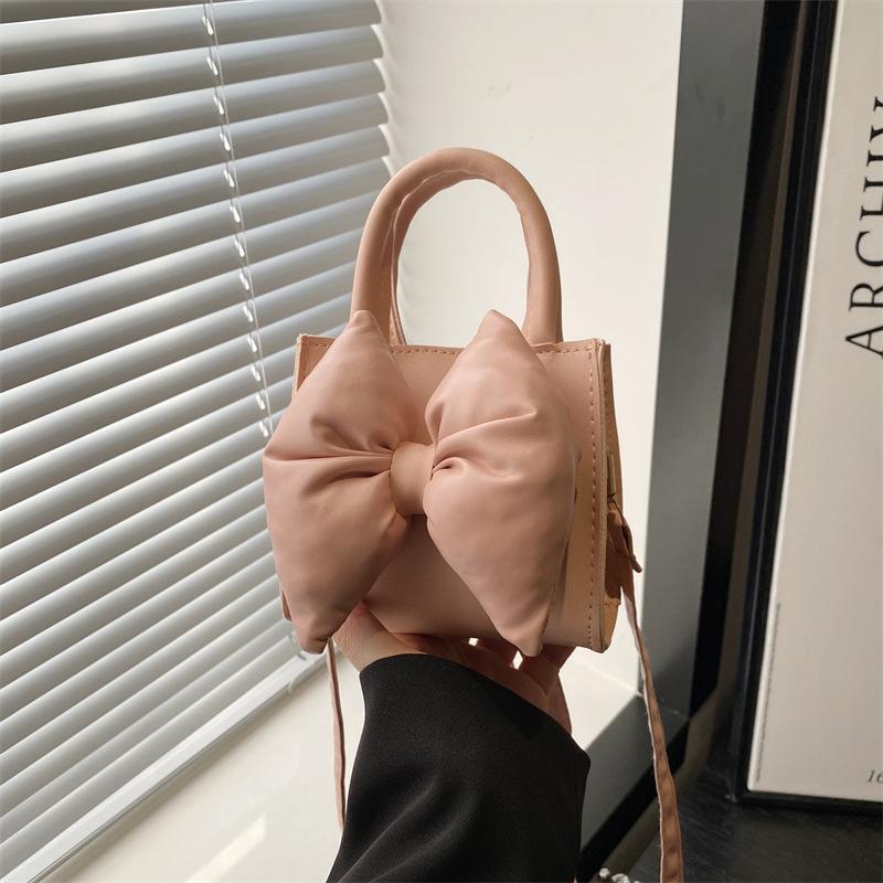 Niche bow solid color new mini hand carry small square bag summer beautiful retro shoulder messenger bag women