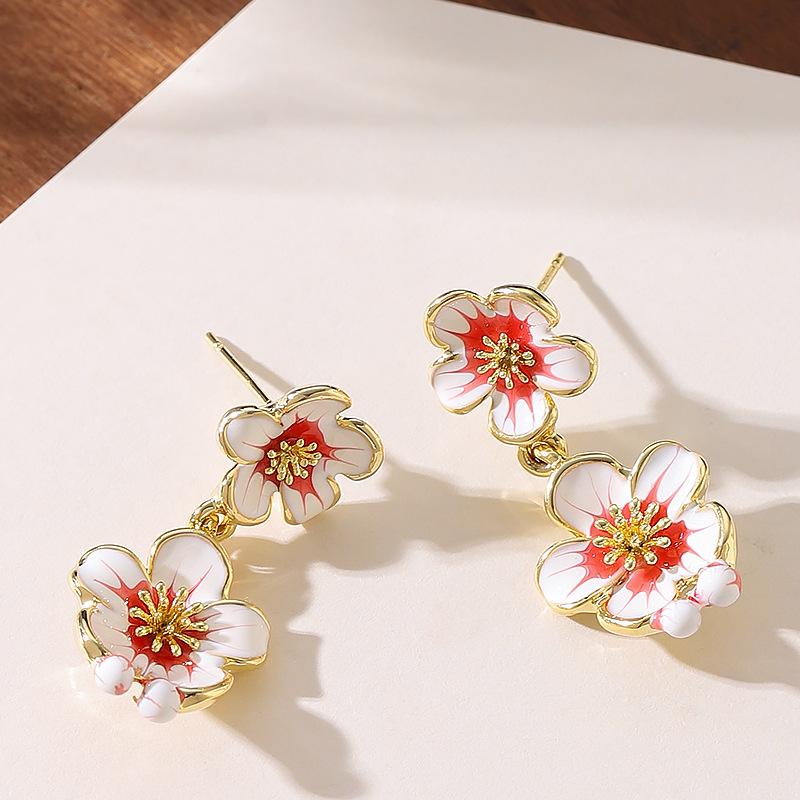 

Mori sweet temperament vacation wind dripping oil fringed flower earrings high sense niche exquisite long atmospheric earrings