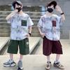 Boys' summer sports and leisure two-piece set, children's ink printed short sleeved shorts, teenagers' outdoor set
