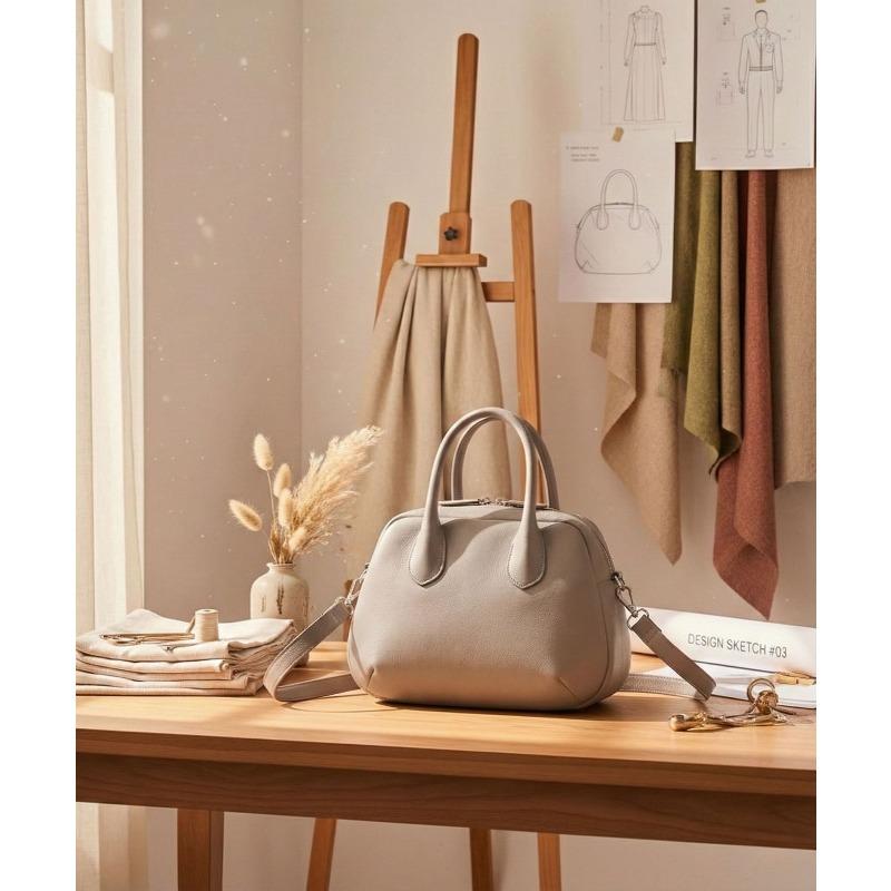 Es ist eine Damen-Handtasche, eine lässige Schalentasche, eine modische vielseitige Umhängetasche und eine einfarbige Damentasche.