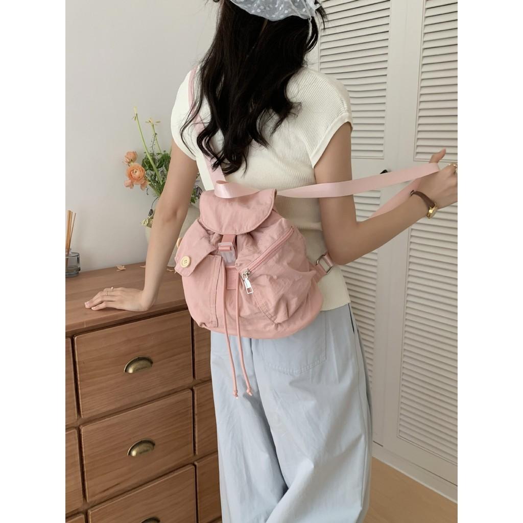 IELGY new Korean niche design outdoor pocket button drawstring double shoulder nylon backpack
