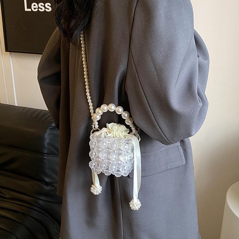 Daily commute imitation pearl woven hollow mini women lipstick earphone bag spring new shoulder messenger bag