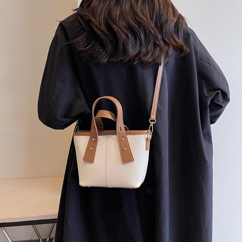 Niche design bucket bag women's bag new contrasting color handbag texture foreign style shoulder bag feeling messenger bag
