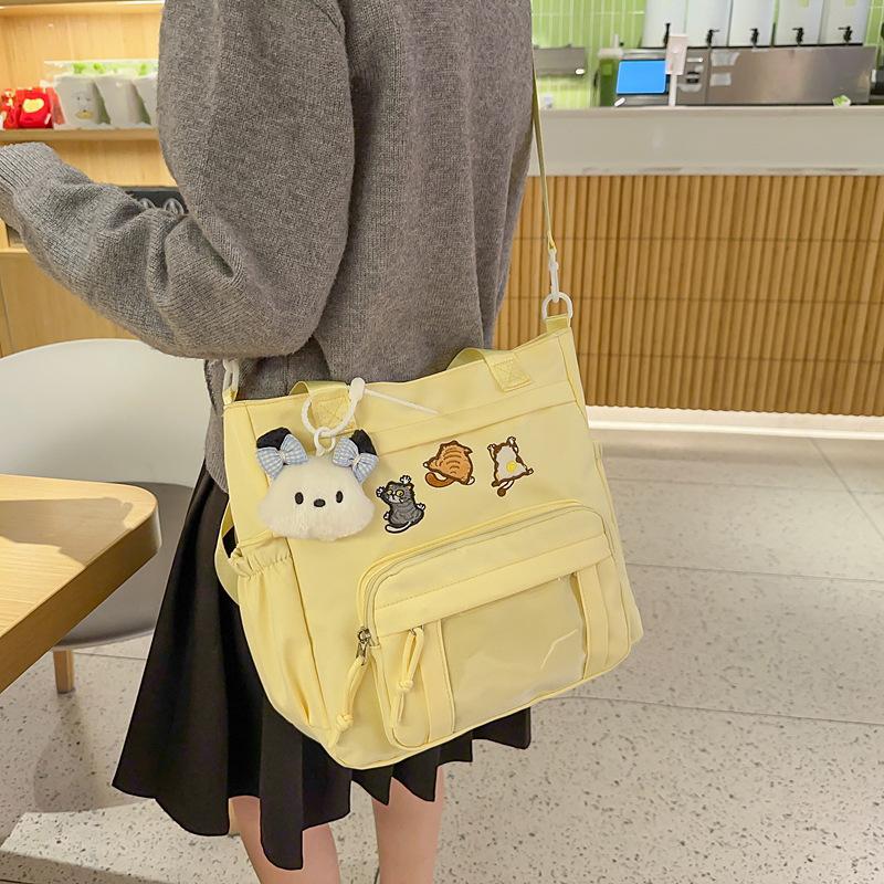 Cute messenger bag women's 2025 new Japanese pain bag large-capacity shoulder bag girl junior high school student portable tote bag