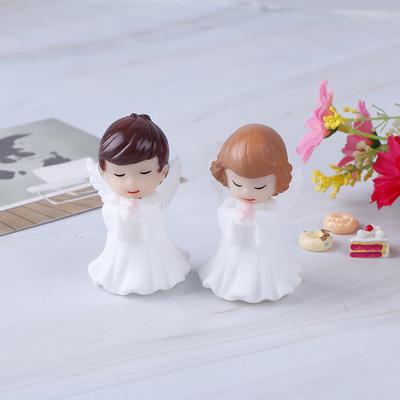 Decorazione per torta con due statuette di angioletti
