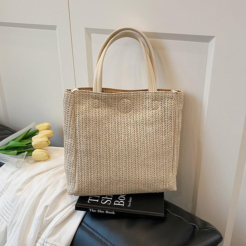 

Straw bag women s 2025 spring new large-capacity simple bucket bag beach woven contrasting color portable tote bag коричневый