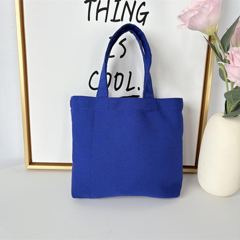 Effenkleurige eenvoudige lunchtas, draagbare canvas tas, kleine stoffen tas, draagbare canvas tas voor het opbergen van diverse spullen