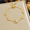 Gold Flower Charm Bracelet with Crystal Accents for Women