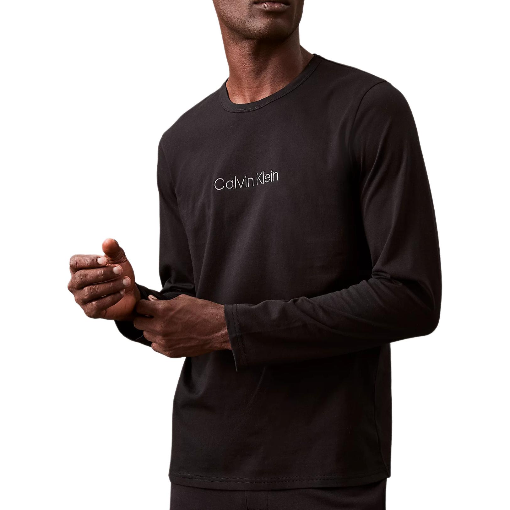 

Calvin Klein Однотонная вышивка букв Круглый вырез Длинный рукав Пижамный топ Мужские топы Черный 000NM2771E-UB1 XL