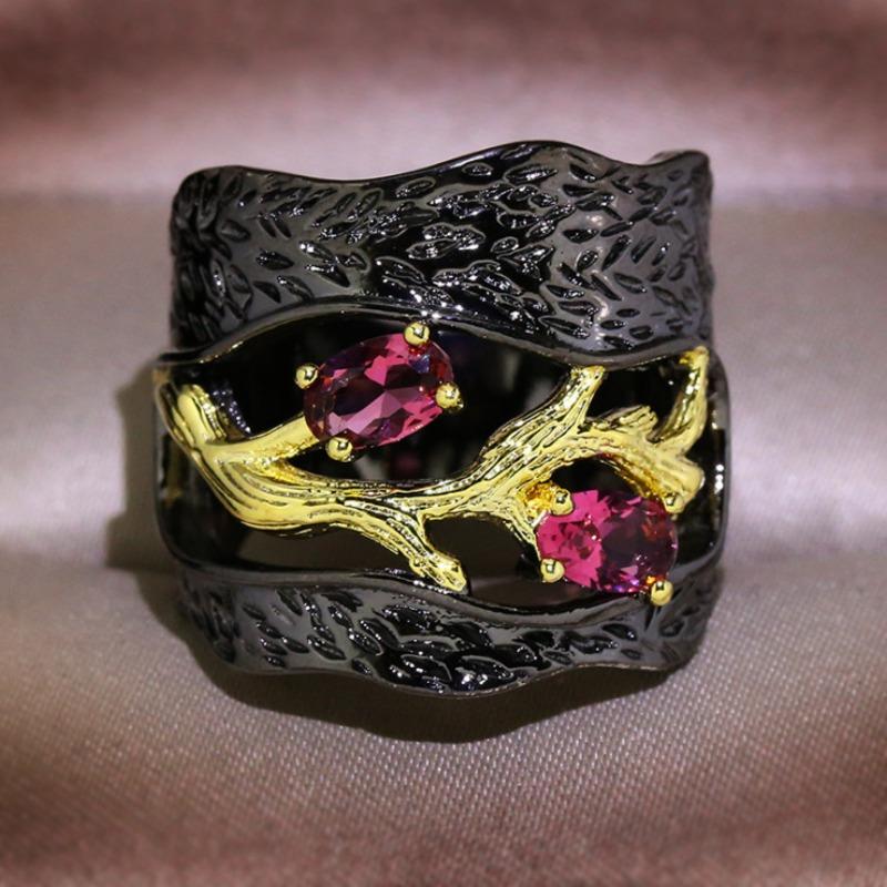 Black and gold branch ring with inlaid accents. Unique art style for Halloween and Christmas—mysterious and fantastical.