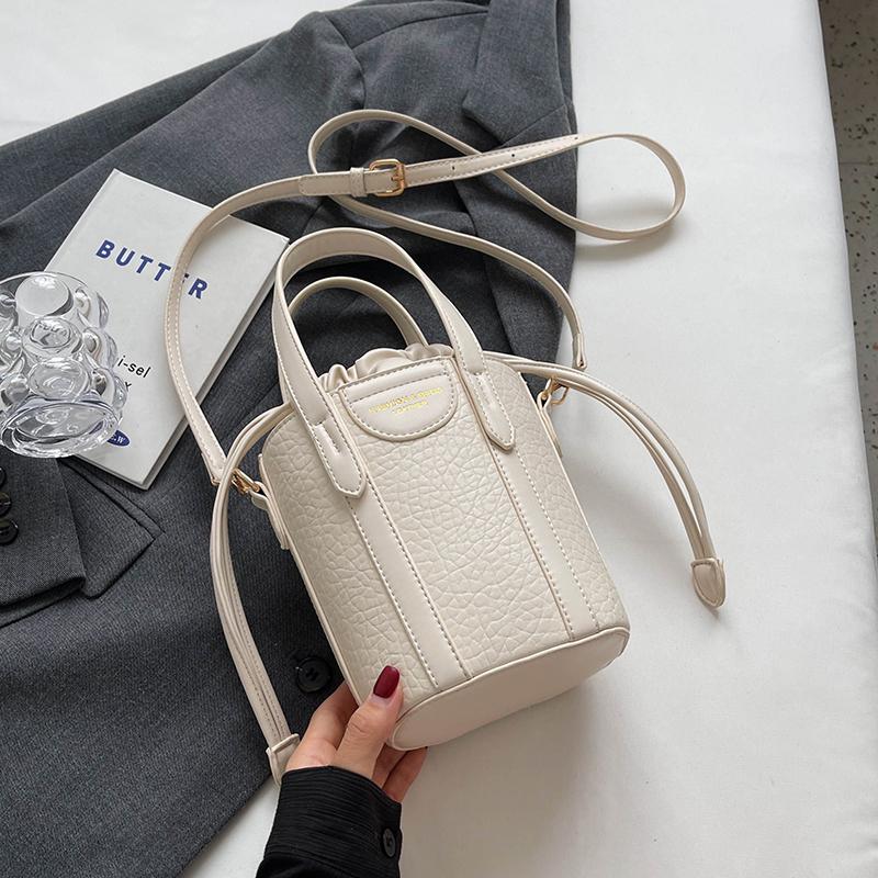 

Ретро мини женская сумка из искусственной кожи женская сумка через плечо модная сумка-ведро с буквенным шнуром на одно плечо новая текстура