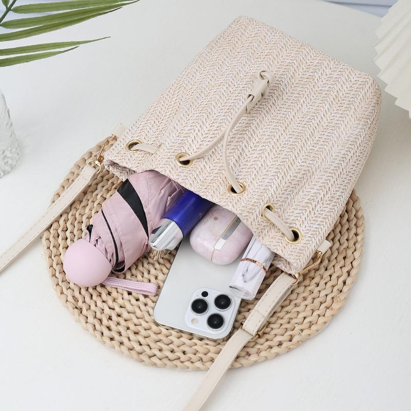 Bohemian Beige Straw Woven Bucket Crossbody Bag with Drawstring Closure Adjustable Leather Strap, Ideal for Beach Casual Daily