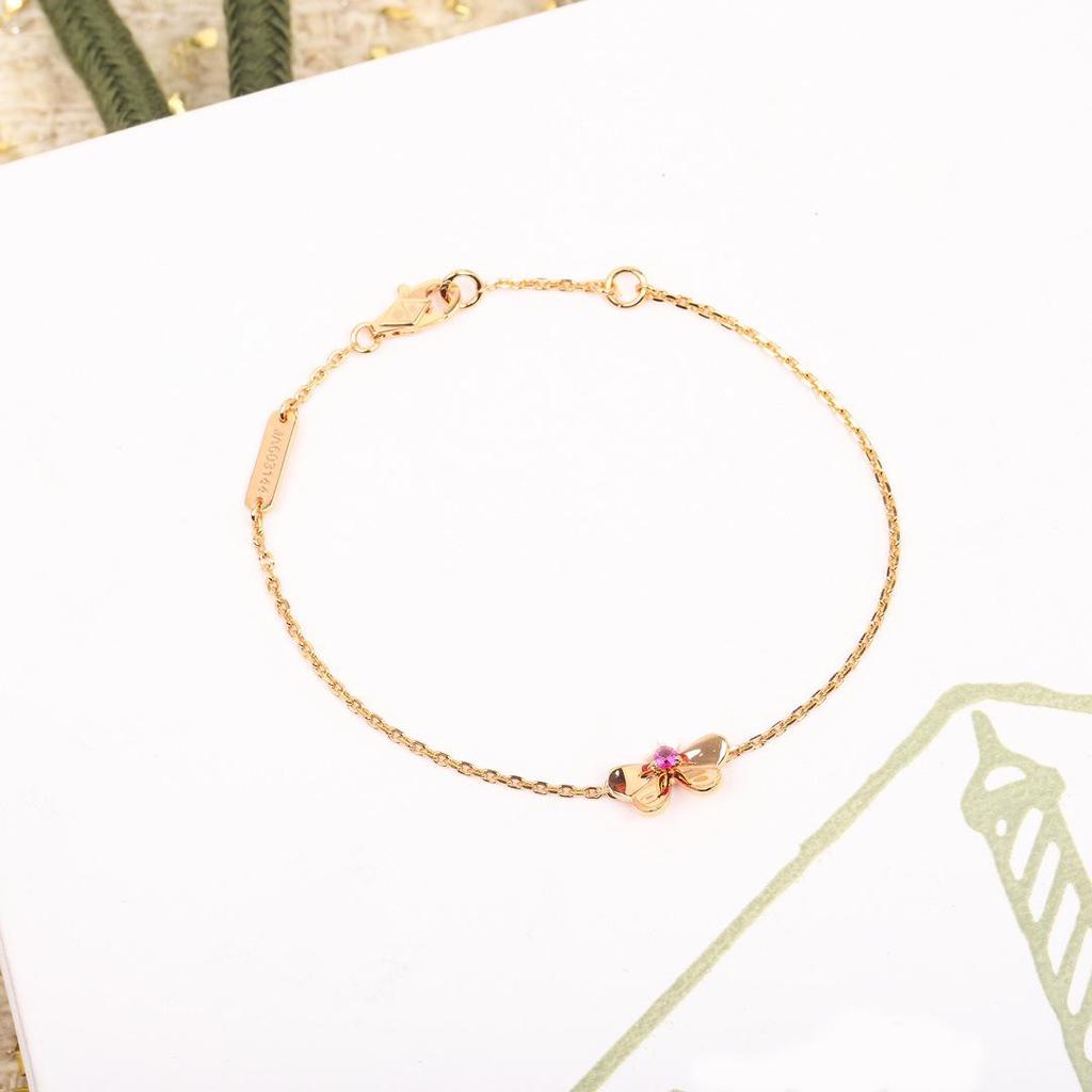 Exquisite Gold-Plated Copper Bracelet with Diamond-Studded Three-Leaf Clover Design