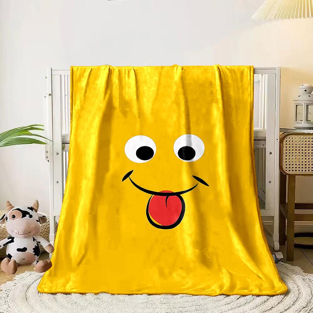 

A playful smiling face on yellow background sticking out a red tongue. for all seasons blanket lunch break throw gift 80cm x 120cm