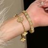 Sweet Golden Four-leaf Clover Bracelet with Laser Kaleidoscope Design, Light Luxury Sparkling Diamonds, High-end Stainless Steel Jewelry for