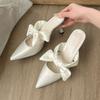 Height-increasing stiletto 2025 summer new bow pointed head bag head cool slippers women's niche going out high-value slippers