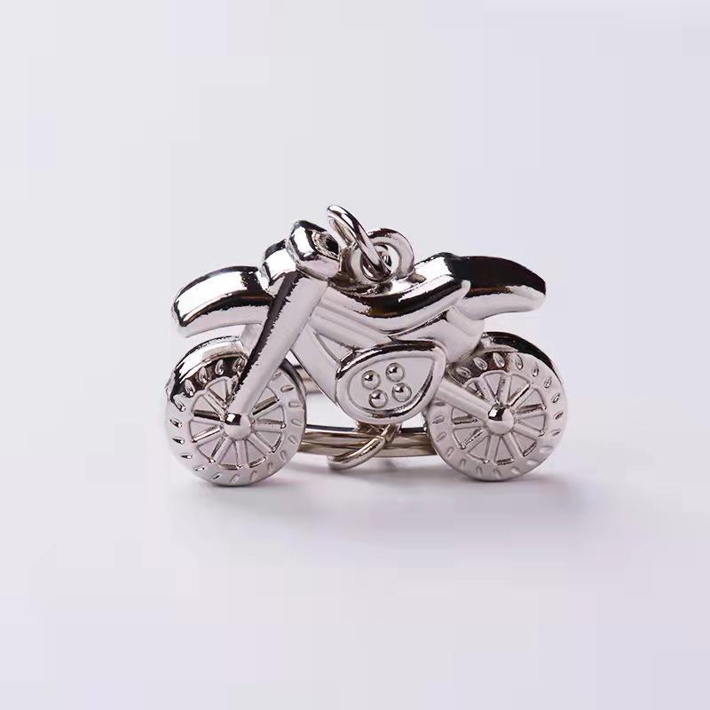 Лазерлік логотипі бар металл мотоцикл салпыншақ - бірегей жарнамалық сыйлық немесе шағын жетон.