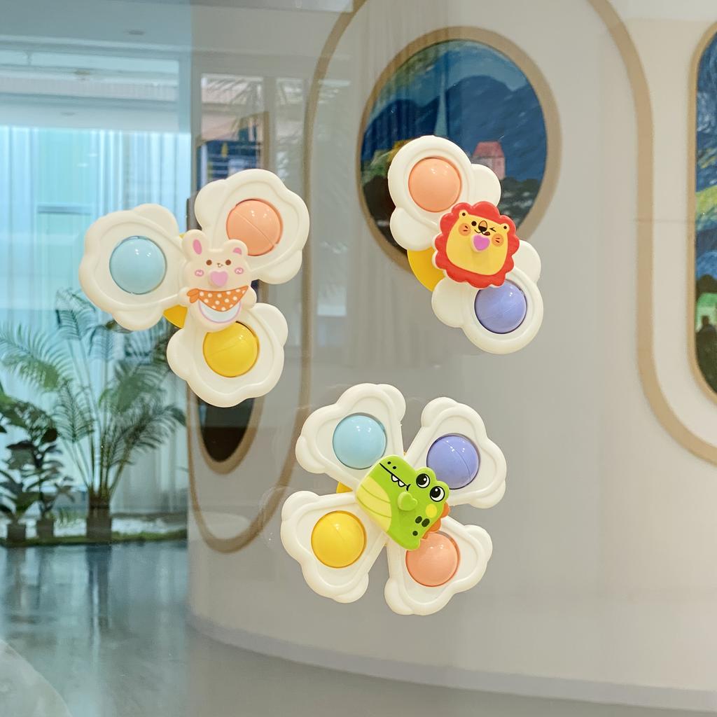 A Set of Three Cartoon Animal Suction Cup Spinning Tops for Babies, Designed To Enhance Hand-Eye Coordination During Early Education
