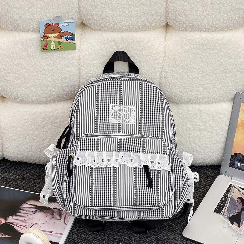 Simple casual striped schoolbag Female junior high school student backpack Large capacity class commuter travel backpack